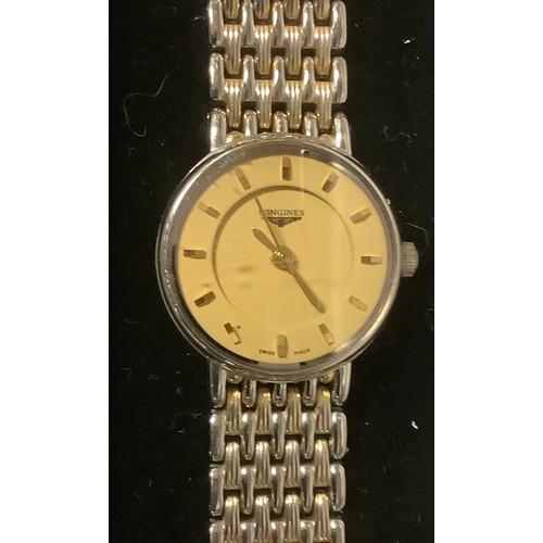 392 - A lady's Longines Flagship quartz wristwatch, champagne dial with baton indicators, two tone integra... 