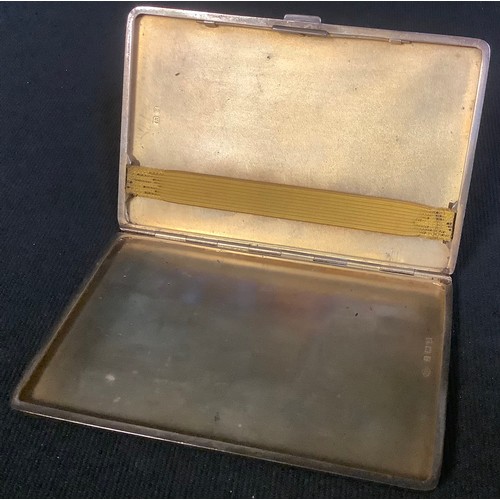 602 - A George V silver rounded rectangular cigarette case, engine turned, monogrammed, Birmingham 1932, 1... 