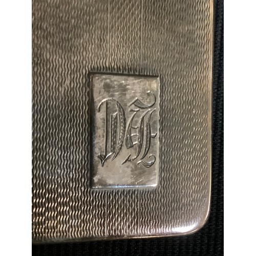 602 - A George V silver rounded rectangular cigarette case, engine turned, monogrammed, Birmingham 1932, 1... 