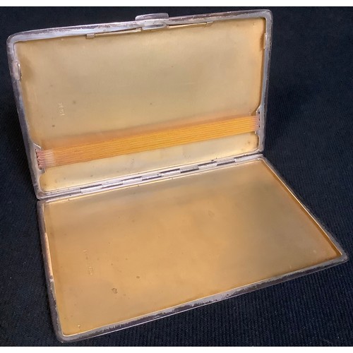 603 - An Elizabeth II silver rounded rectangular cigarette case, engine turned, gilded interior, Birmingha... 