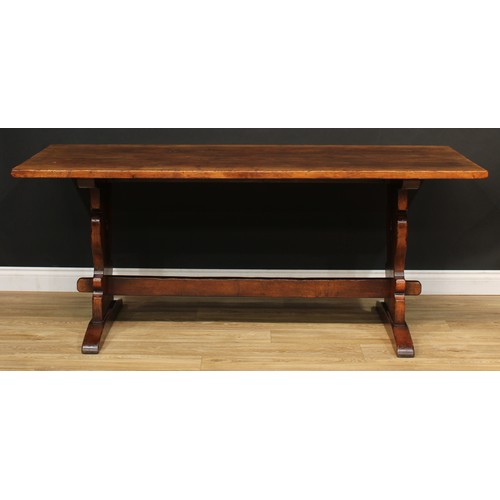 101 - A Titchmarsh & Goodwin oak refectory trestle dining table, 76cm high, 183cm long, 80.5cm wide; a set... 