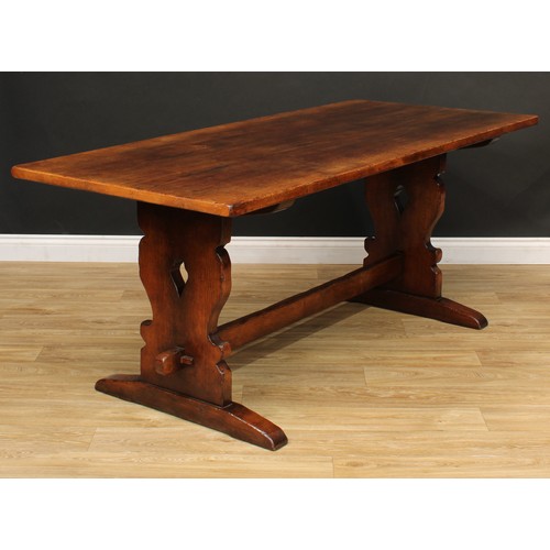 101 - A Titchmarsh & Goodwin oak refectory trestle dining table, 76cm high, 183cm long, 80.5cm wide; a set... 