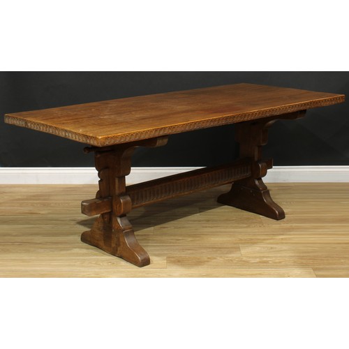 105 - An oak refectory trestle dining table, probably Rupert or Nigel Griffiths Monastic Woodcraft, rectan... 