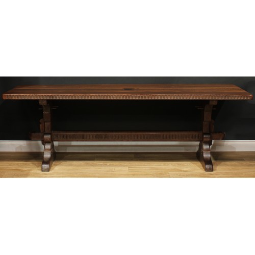 107 - A large oak refectory trestle dining table, probably Rupert or Nigel Griffiths Monastic Woodcraft, r... 