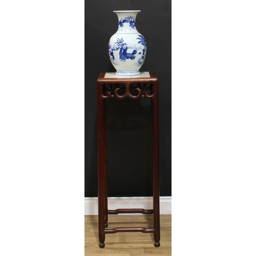 112 - A Chinese hardwood tall vase or jardiniere stand, square top with inset marble panel above a deep fr... 