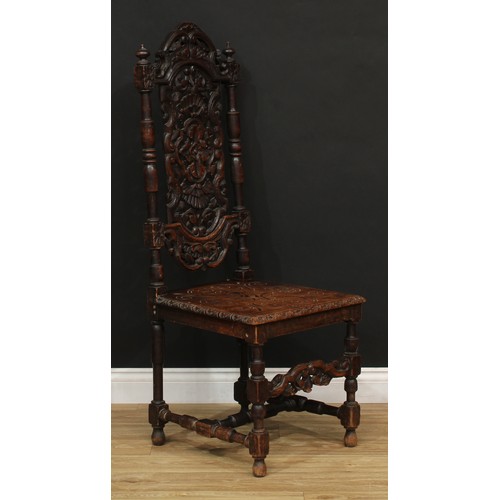 205 - A William and Mary Revival carved oak dining or hall chair, 127.5cm high, 49cm wide, the seat 42cm d... 