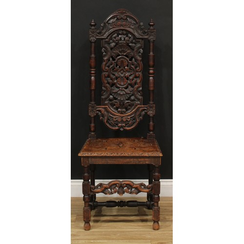 205 - A William and Mary Revival carved oak dining or hall chair, 127.5cm high, 49cm wide, the seat 42cm d... 