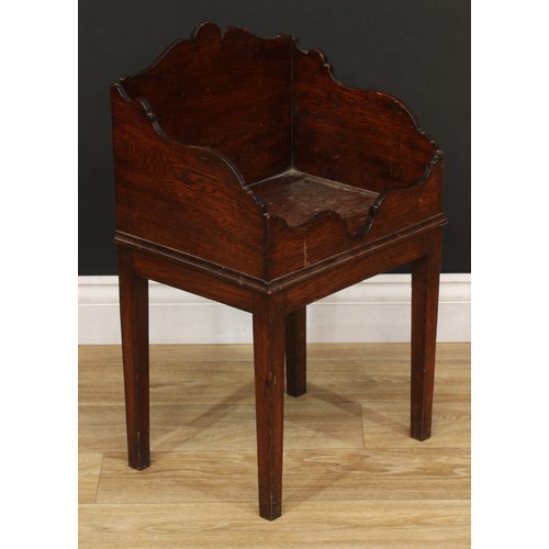 206 - A 19th century oak bottle stand, 63.5cm high, 39cm wide, 30cm deep