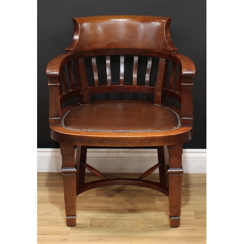 209 - An early 20th century mahogany desk chair, curved cresting rail, studded stuffed-over seat, Crinolin... 