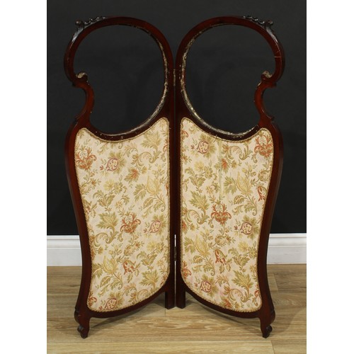 211 - A 19th century Rococo Revival mahogany two fold screen, 102cm high, each panel 38cm wide