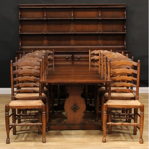 220 - An Ercol dresser, 175.5cm high, 215cm wide, 51cm deep; an Ercol drawer leaf dining table, 74.5cm hig... 