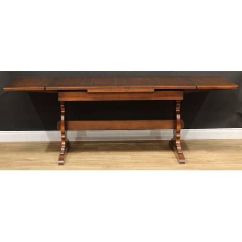 220 - An Ercol dresser, 175.5cm high, 215cm wide, 51cm deep; an Ercol drawer leaf dining table, 74.5cm hig... 