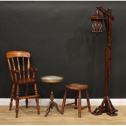 541 - An oak floor-standing height-adjustable lantern lamp; a child's high chair; a stool, stamped T.W. Ed... 