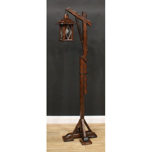 541 - An oak floor-standing height-adjustable lantern lamp; a child's high chair; a stool, stamped T.W. Ed... 