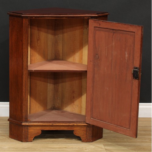 542 - A Sheraton inspired satinwood banded mahogany wall hanging splay front corner cupboard, of small pro... 