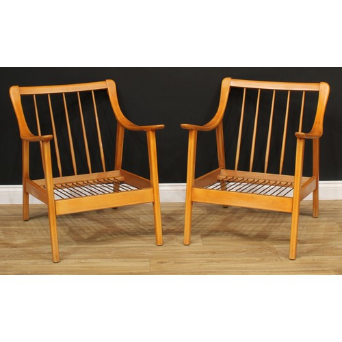 544 - A pair of retro mid-20th century elbow chairs, 78cm high, 66.5cm wide, the seat aperture 51cm wide a... 