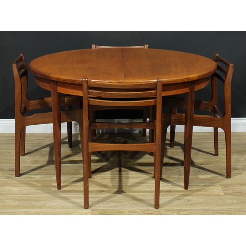 549 - A retro mid-20th century teak extending dining table, 73cm high, 122cm diameter opening to 148cm lon... 