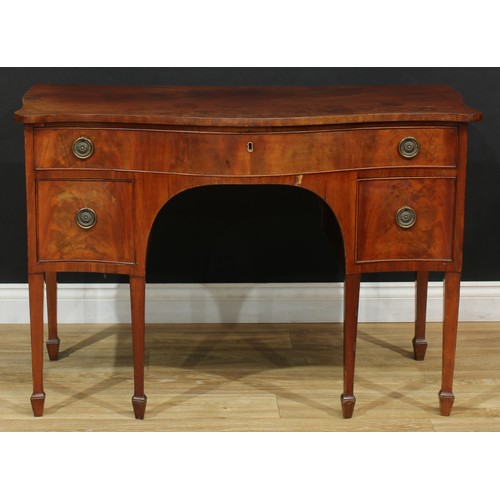 550 - A 19th century mahogany serpentine serving table, slightly oversailing top above one long and two sh... 