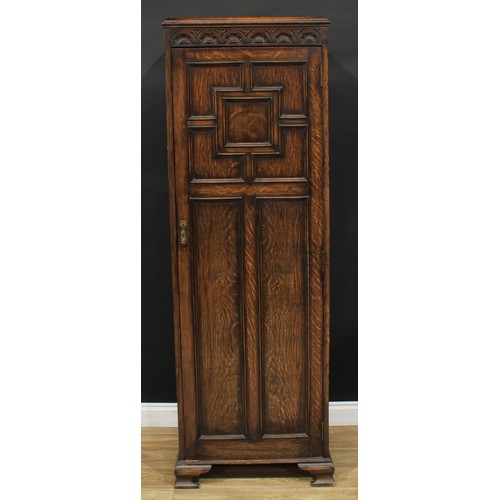 621 - An oak hall robe, carved and moulded in the 17th century style, 181cm high, 61cm wide, 44cm deep; a ... 