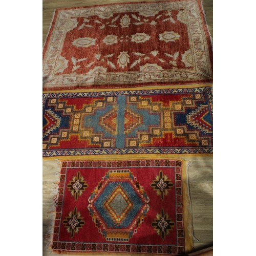 627 - A Middle Eastern Chobi type rug or carpet, 180cm x 126cm; others, similar, 163cm x 70cm and 100cm x ... 