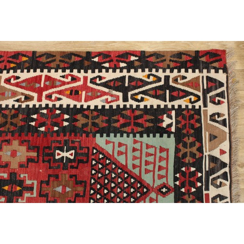 628 - A Middle Eastern rectangular woollen kilim rug, 140cm x 94cm