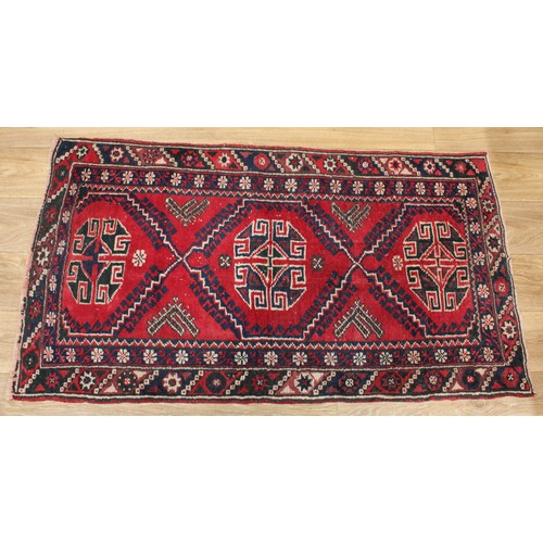 630 - A Middle Eastern rectangular woollen rug, 138cm x 72cm