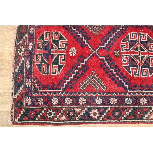 630 - A Middle Eastern rectangular woollen rug, 138cm x 72cm