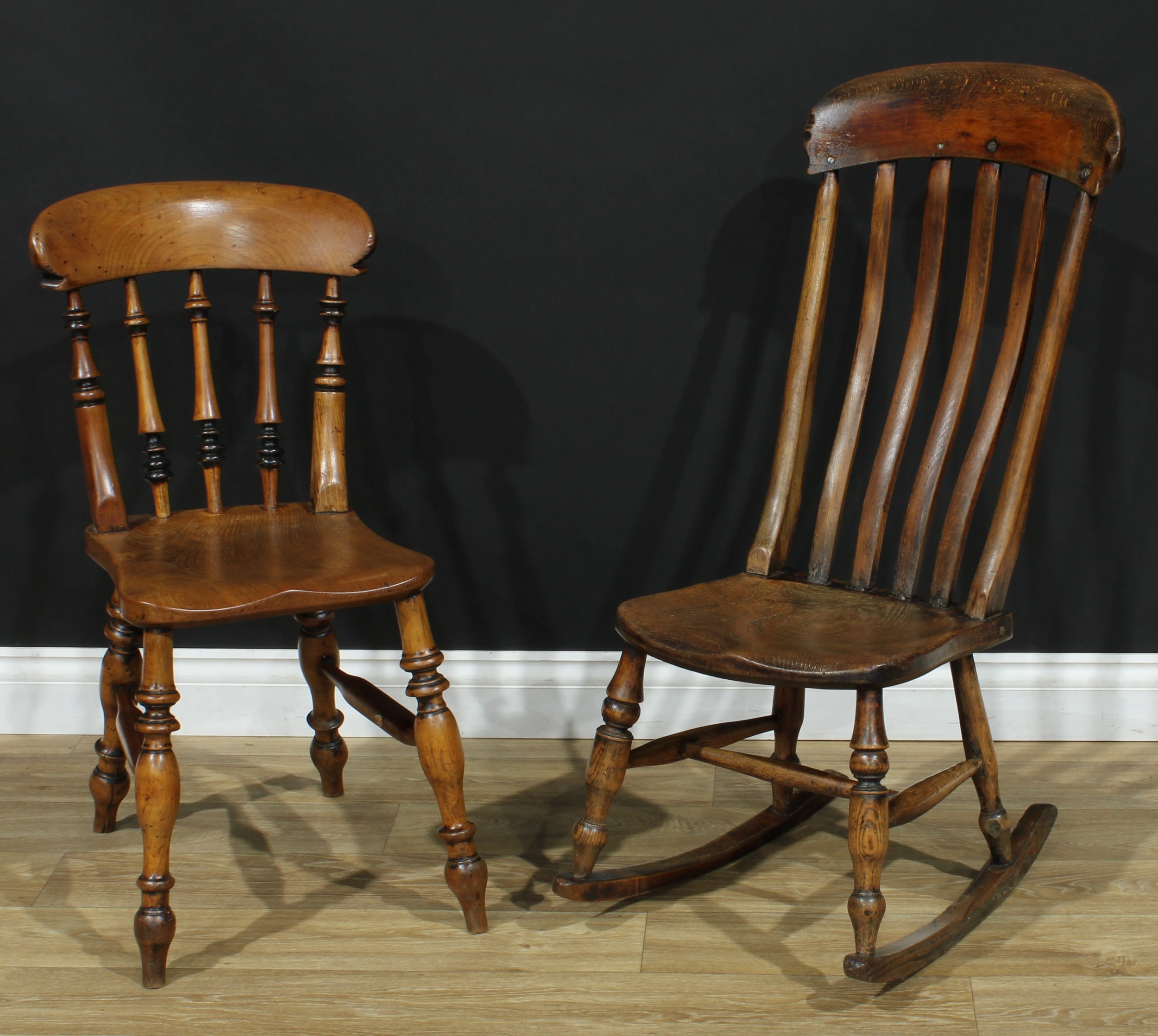A 19th century elm-seat lath back rocking chair, 94.5cm high...