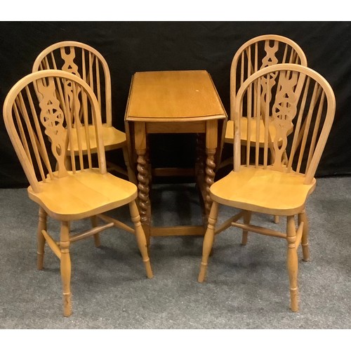 171 - A set of four pine wheel back side chairs, saddle seats, H-stretchers; a 20th century oak drop leaf ... 