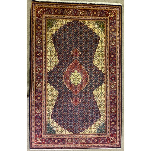 180 - A Persian fine Tabriz woollen carpet, 210cm x 131cm