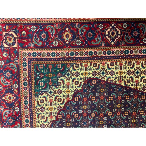 180 - A Persian fine Tabriz woollen carpet, 210cm x 131cm