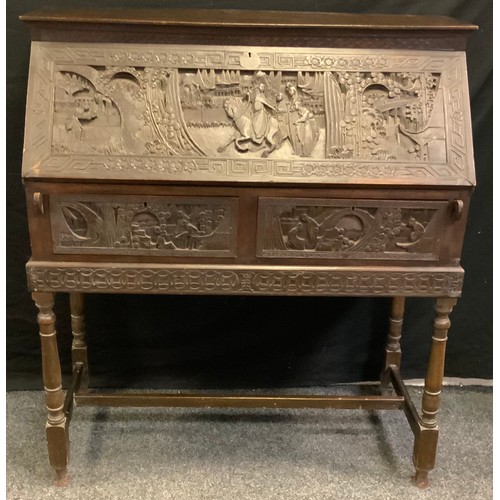 182 - A 19th century camphor wood bureau, oriental carved far front decorated with traditional figures, tw... 