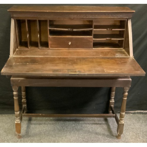 182 - A 19th century camphor wood bureau, oriental carved far front decorated with traditional figures, tw... 