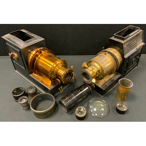 191 - A late Victorian lacquered brass and black painted magic lantern, c.1890;  another, both cased;  var... 