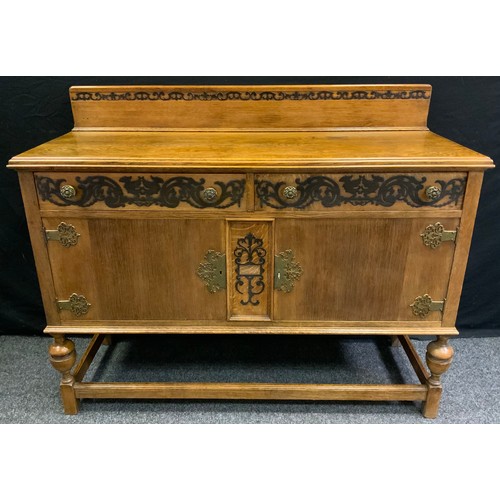 200 - A 20th century oak sideboard, shaped half gallery, rectangular top above, two short drawers and two ... 