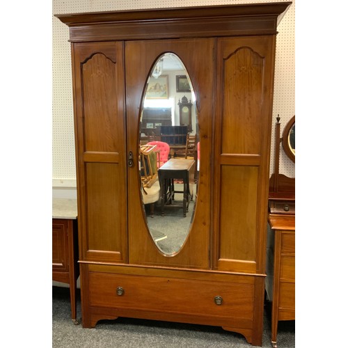 206 - An Edwardian mahogany inlaid wardrobe, outswept cornice above a central bevelled mirrored door and a... 