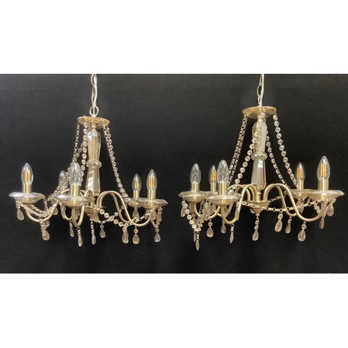 208 - A pair of lustre glass five branch chandeliers, brushed steel scrolled arms, beaded strings and drop... 