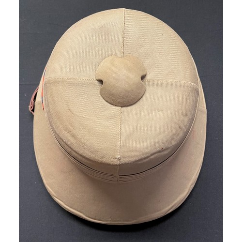 112 - WW2 British pith helmet complete with liner, brown leather chinstrap and Royal Engineers Corps colou... 