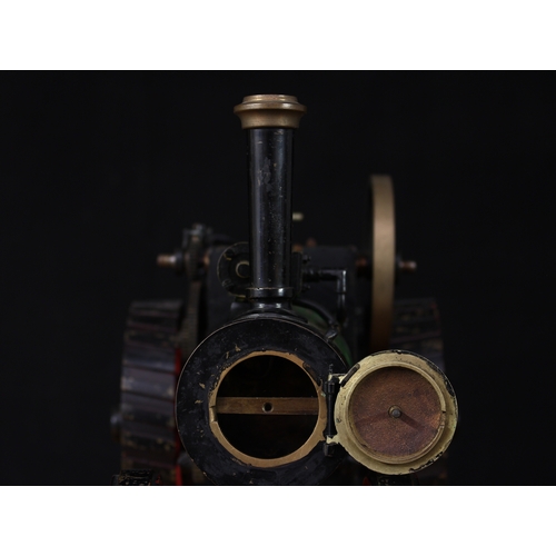 3034 - A live steam model traction engine, green livery, fitted with English style brass straked wheels, 3.... 