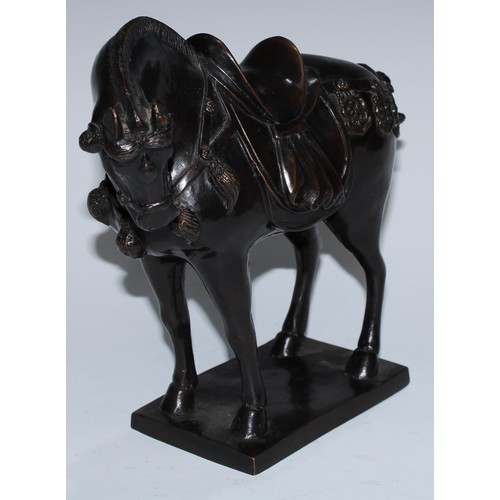 5129 - A Chinse dark-patinated equestrian bronze, of a Tang horse, cast in the archaic manner, square base,... 