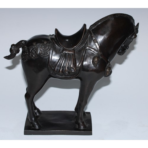 5129 - A Chinse dark-patinated equestrian bronze, of a Tang horse, cast in the archaic manner, square base,... 