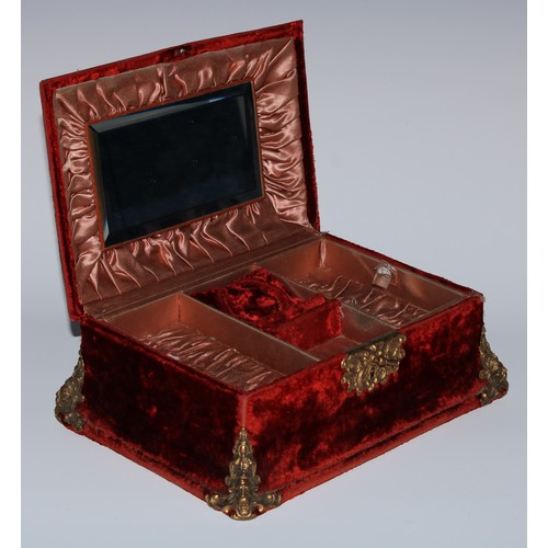 5075 - A Baroque Revival gilt-metal mounted claret plush velvet jewel casket, the slightly domed hinged cov... 