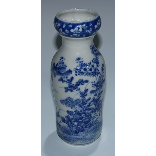 5173 - A Japanese porcelain inverted baluster vase, well-painted with a profusions of chrysanthemums and fl... 