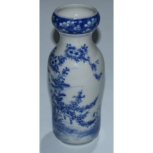 5173 - A Japanese porcelain inverted baluster vase, well-painted with a profusions of chrysanthemums and fl... 