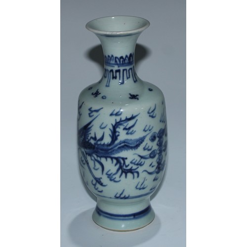 5173 - A Japanese porcelain inverted baluster vase, well-painted with a profusions of chrysanthemums and fl... 