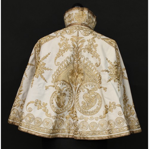 5026 - A 19th century evening or opera cape, richly embroidered in gold thread with meandering foliate scro... 