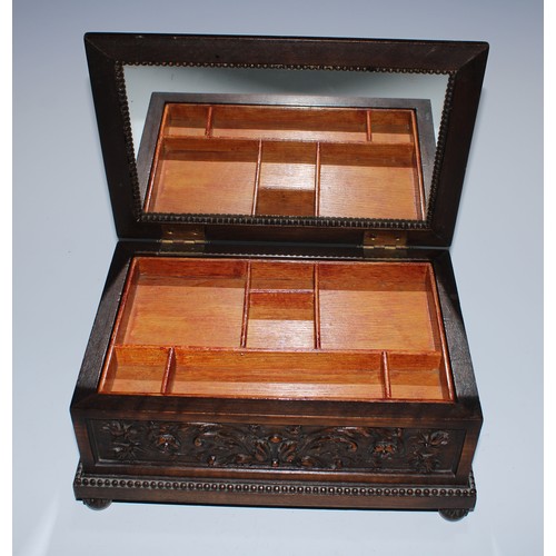 5217 - A near pair of Carolean Revival oak rectangular table-top caskets, the hinged covers boldly carved i... 