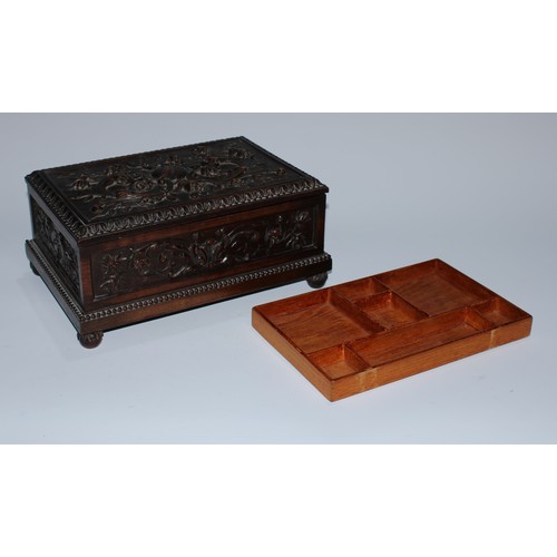 5217 - A near pair of Carolean Revival oak rectangular table-top caskets, the hinged covers boldly carved i... 