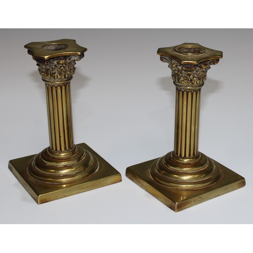 5227 - A pair of 19th century brass Corinthian column candlesticks fluted pillars, stepped socles, square b... 