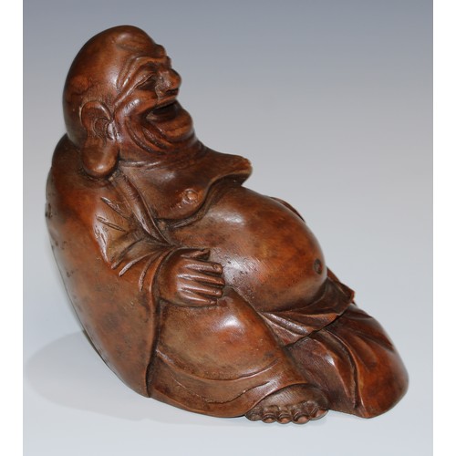 5096 - A Chinese bamboo carving, of Budai, seated, smiling, 20cm high